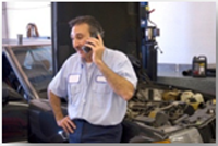 mechanic on the phone in an autoshop