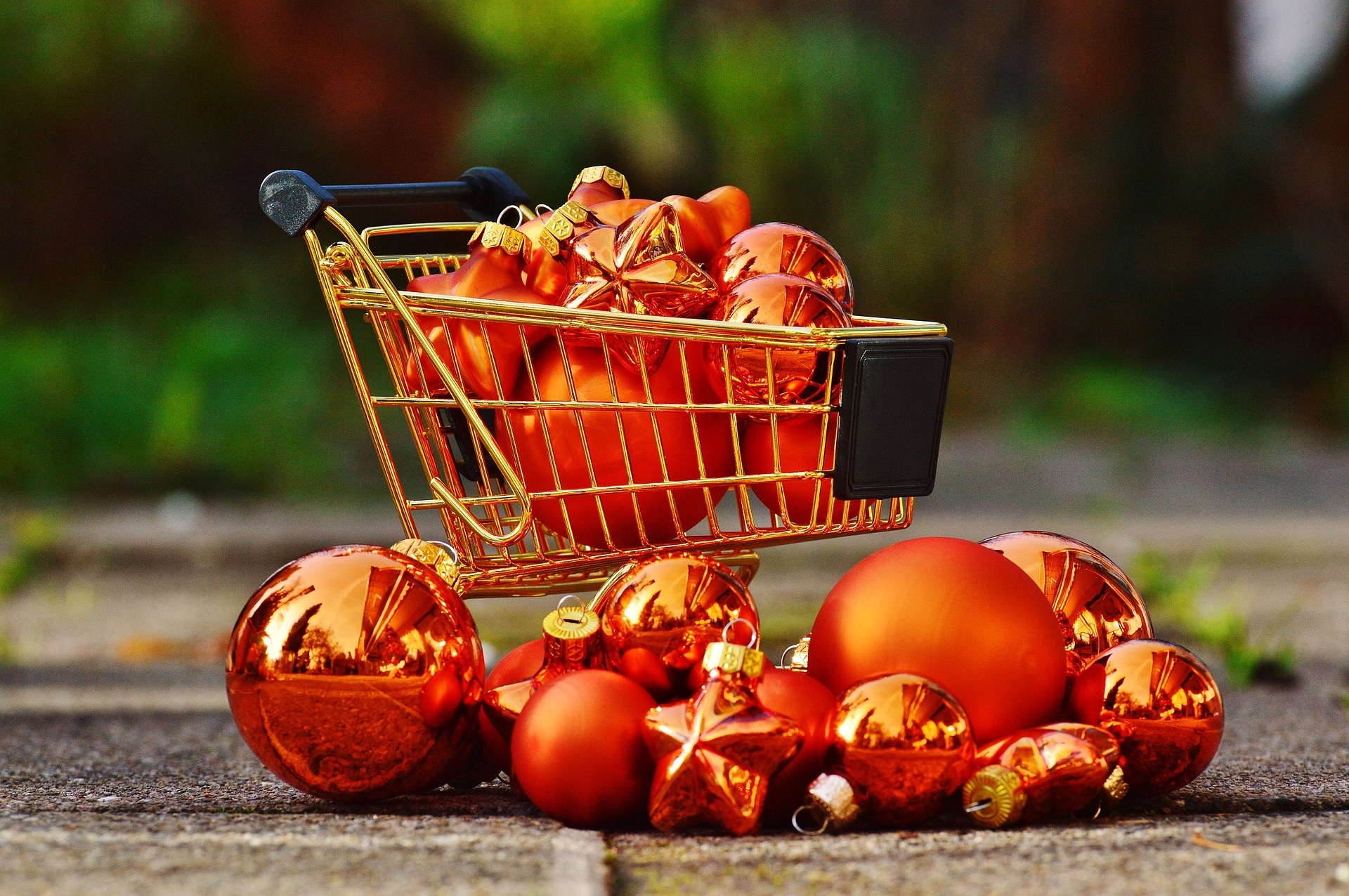 shopping cart full of shiny red ornaments