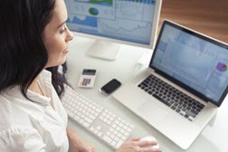 woman sitting at desk on laptop