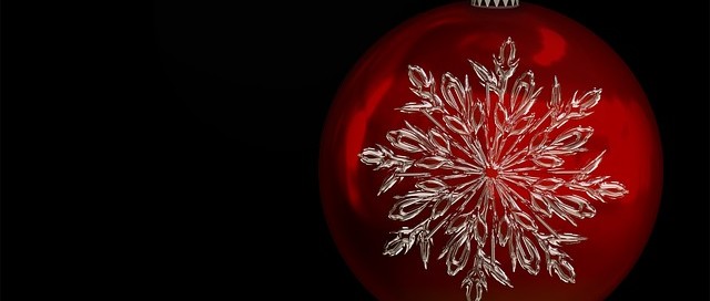 red christmas ornament with white snowflake