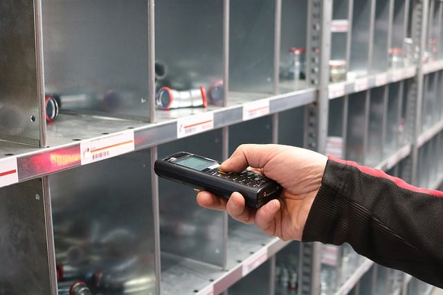 hand scanning parts in a warehouse