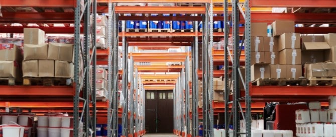 large warehouse containing tall racks of shipments