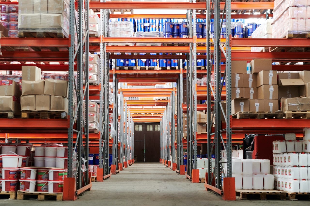 large warehouse containing tall racks of shipments